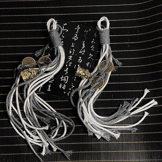 Mountain Ghost - Coin Ornaments with mountain spirit motifs and braided tassels.